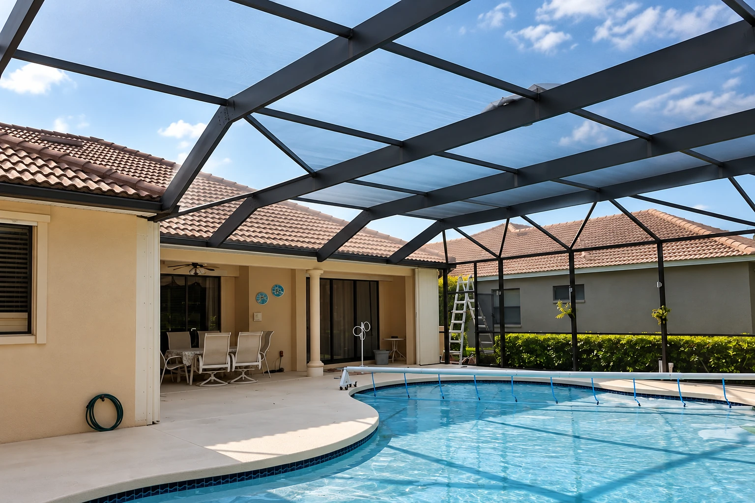 Black-framed patio cover with translucent panels shading a backyard swimming pool.